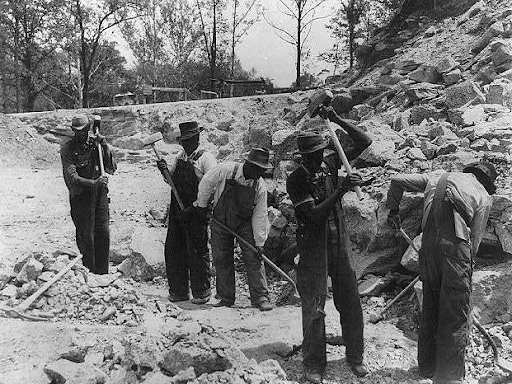 black workers digging 