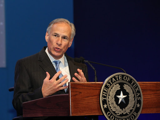gregory abbott speaking at a podium