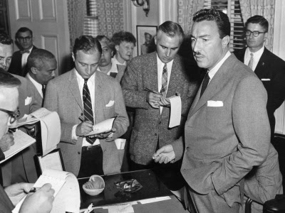 reporters surrounding Adam Clayton Powell 