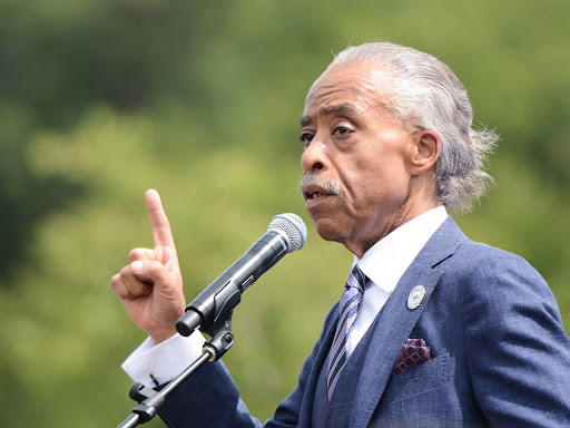al sharpton speaking in front of a microphone