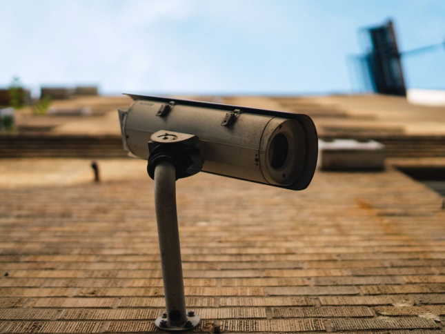 Surveillance camera on wall