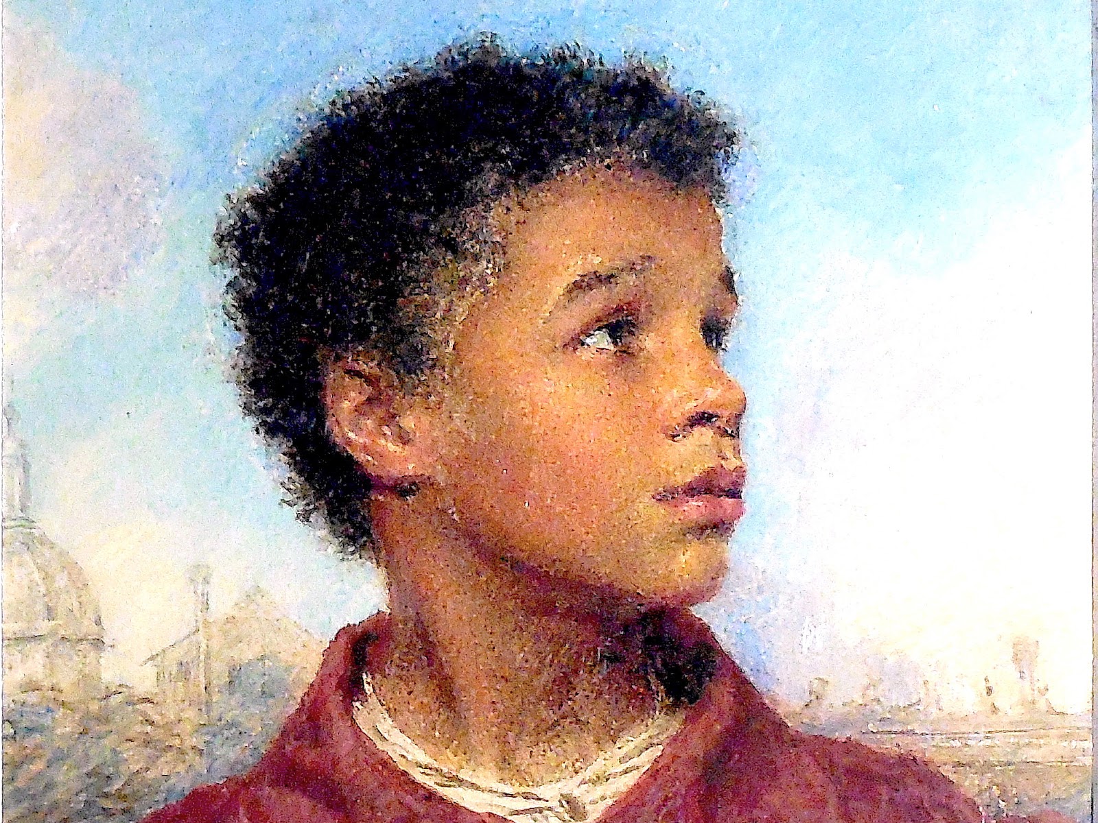 A boy holding a casket