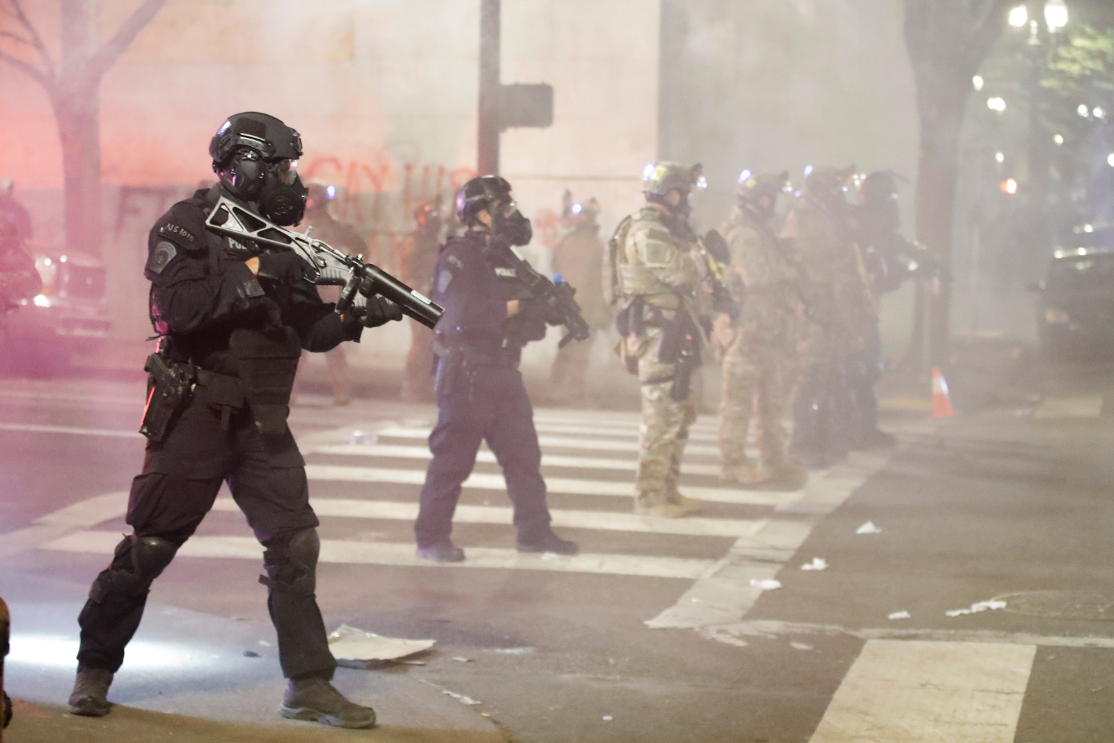 Officers in riot gear with guns