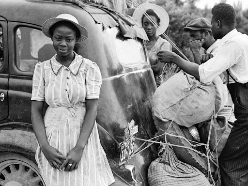 woman standing in front of a car
