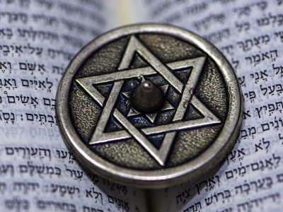 silver Star of David on a Torah
