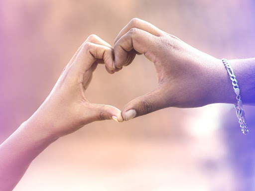 two hands together forming a heart