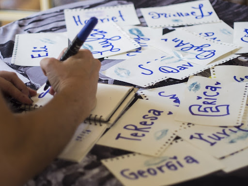 Young person writing on cue cards