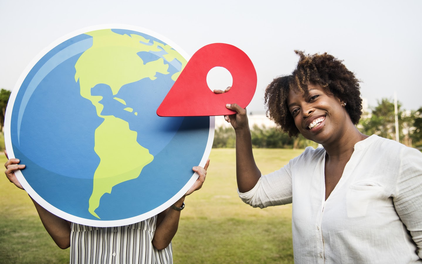 Black women holding globe cut out