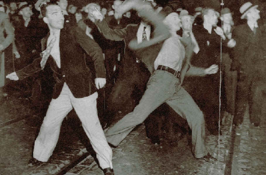 Demonstrators throwing rocks and bricks