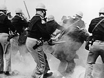 photo of bloody sunday in alabama with police attacking protestors