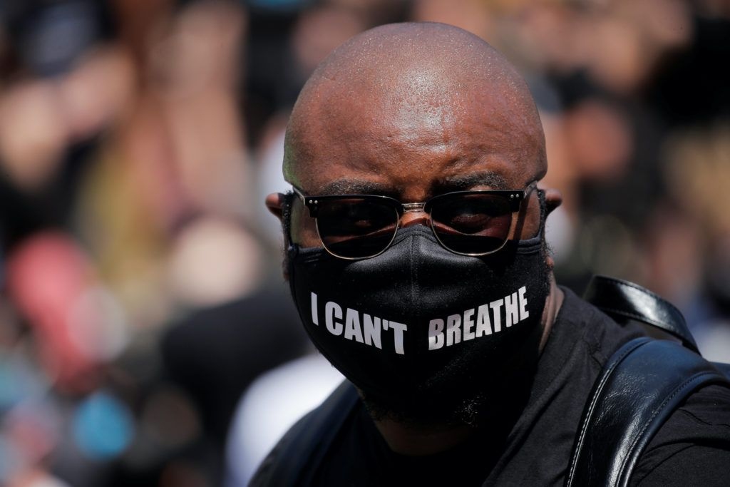 Man wearing "I can't breathe" mask
