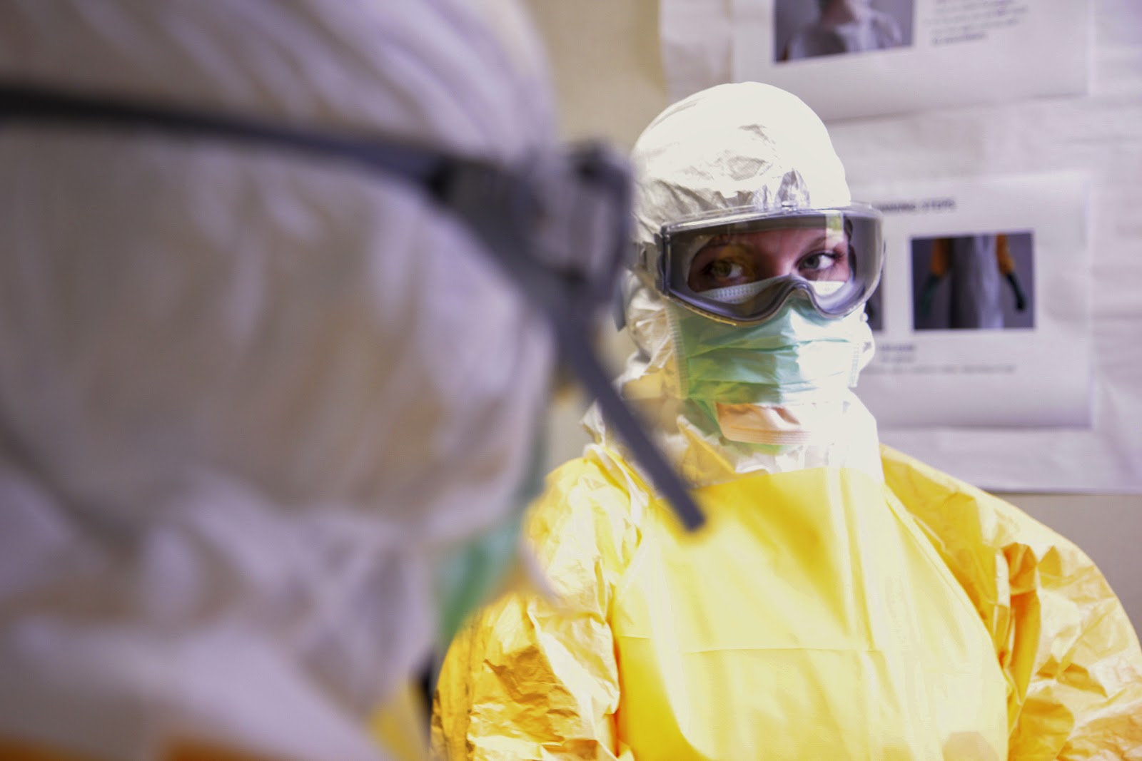 Healthcare workers in protective equipment and googles