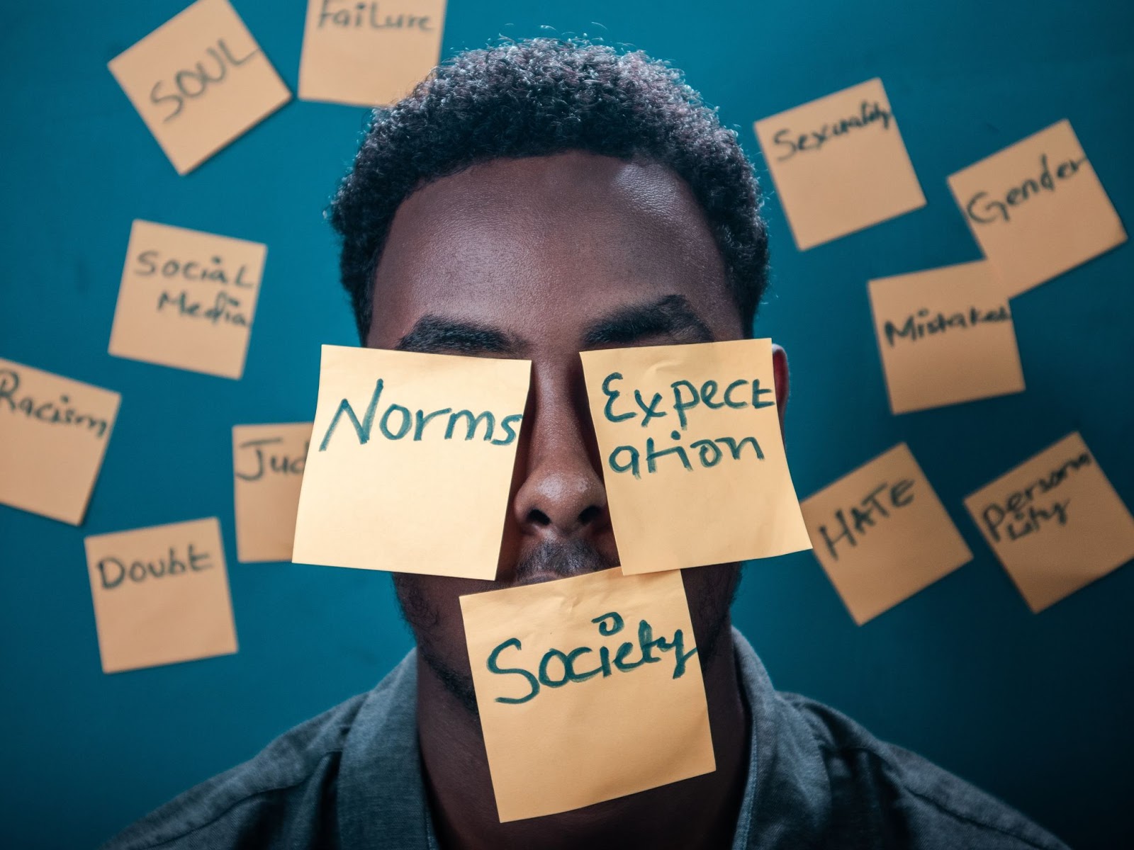 Man with Post it notes on face