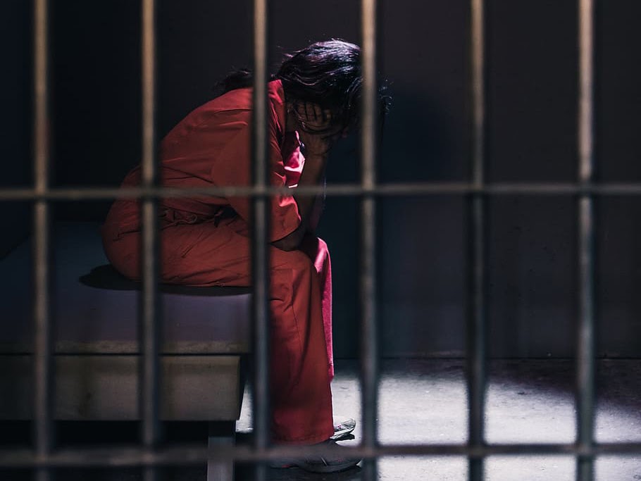 Inmate in jail cell