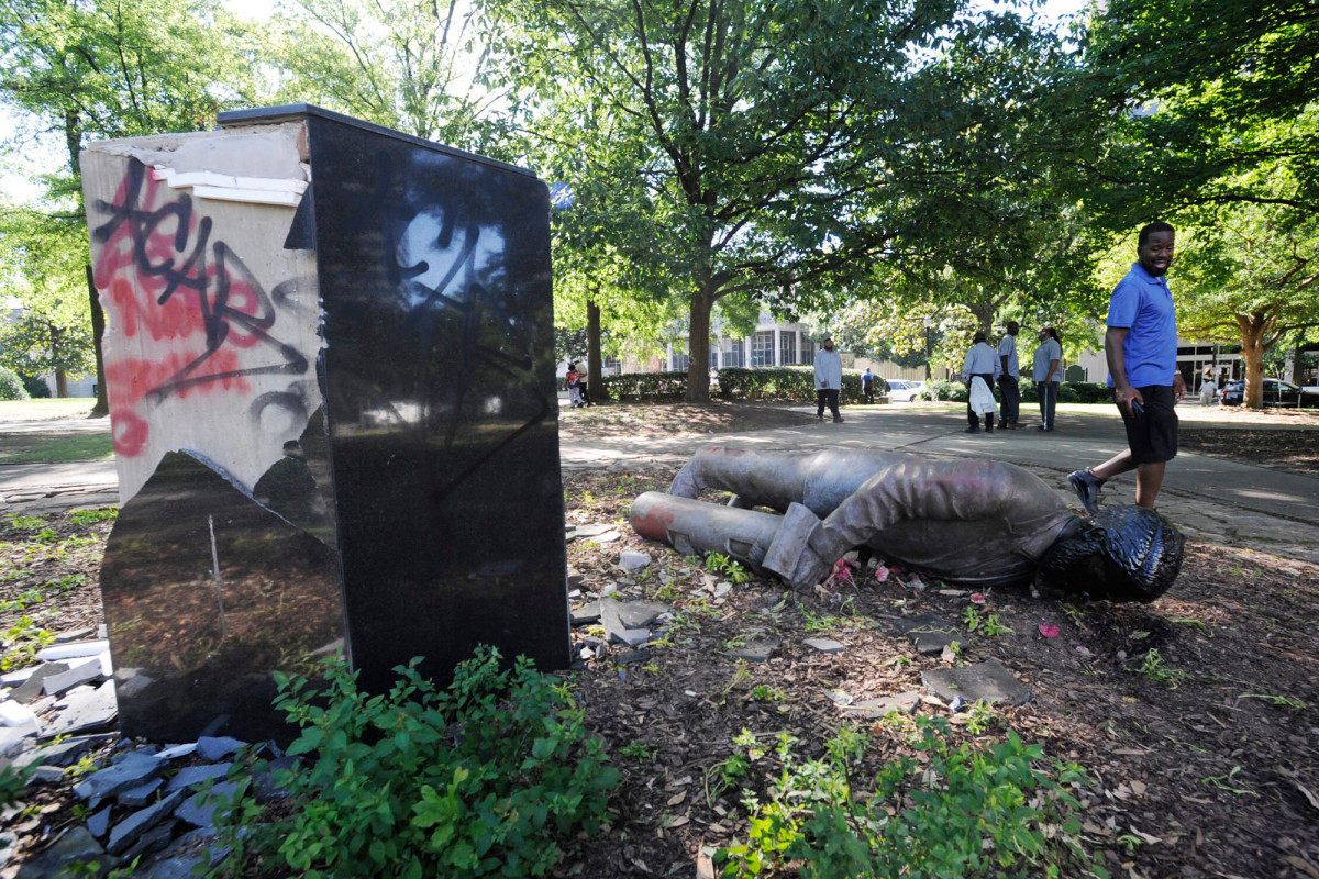 Broken statue laying on ground