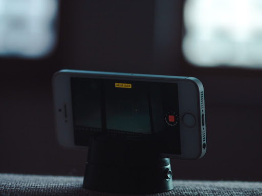 cell phone sitting on a tripod