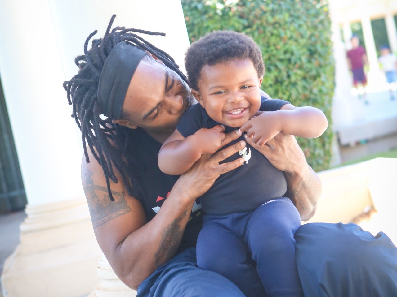 Person holding young child