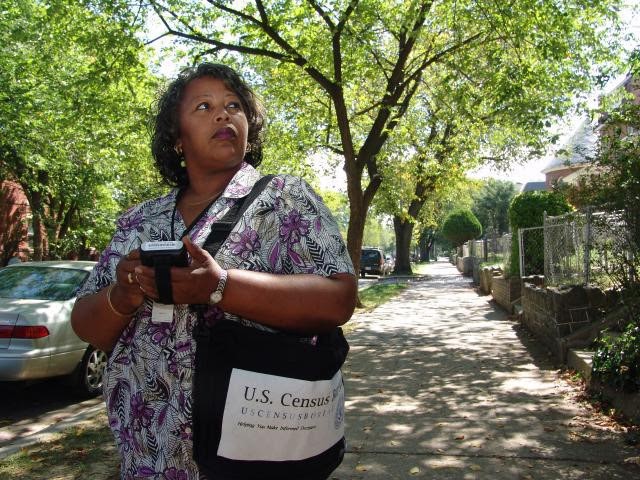 Census enumerator on neighborhood street