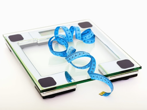 scale with a measuring tape on top