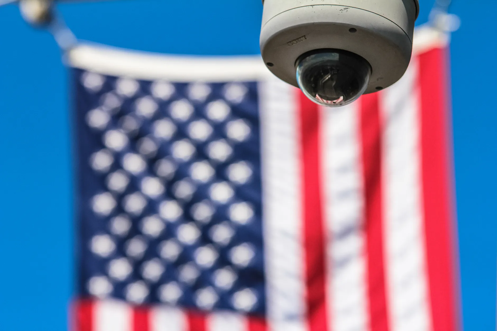 Security camera with American flag in background