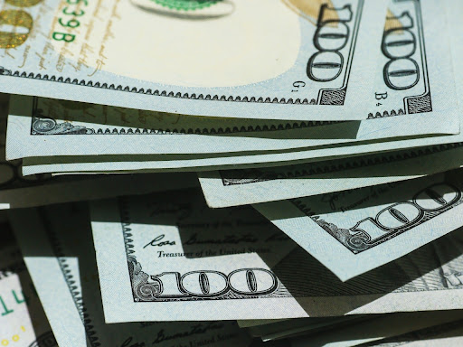 stack of one hundred dollar bills