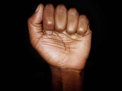 clenched black fist raised 