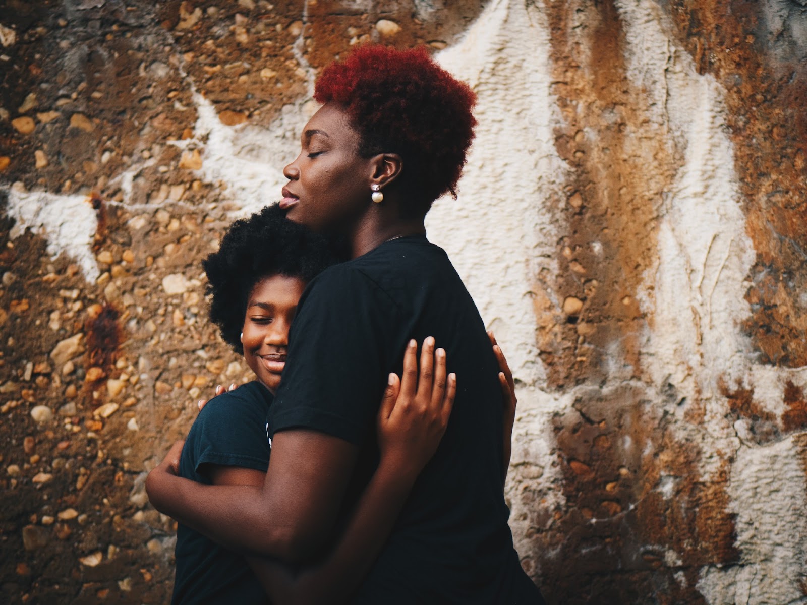 Woman hugging child
