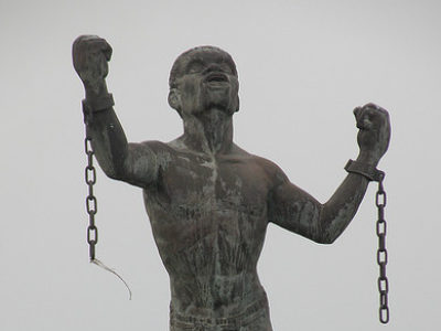 slave in chains yelling 
