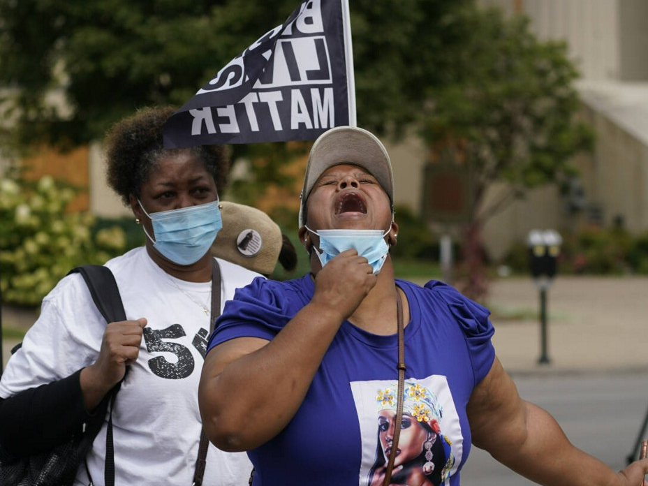 Woman lowering face mask