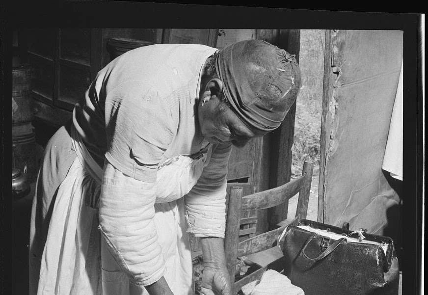 Midwife wrapping her kit to go on-call