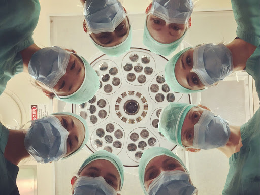operating doctors looking down