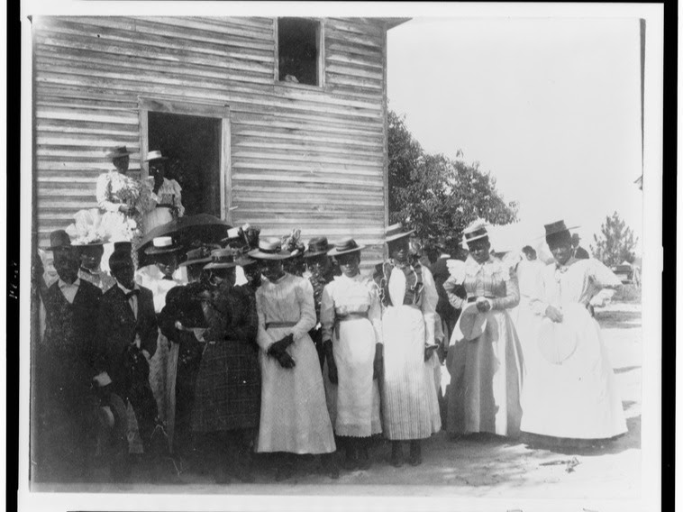 African Americans posed outside of church