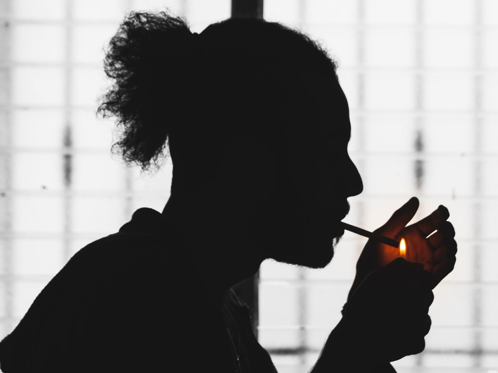 Silhouette of person smoking