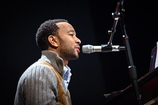 John Legend performing on piano