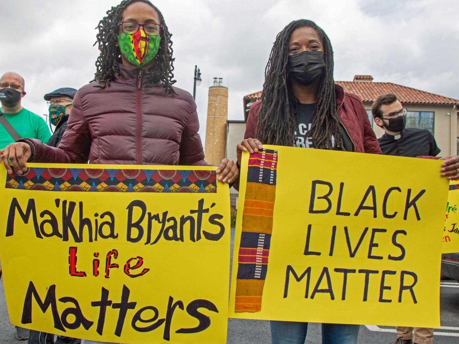 Demonstrators holding signs