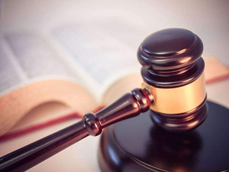 Legal gavel with open law book