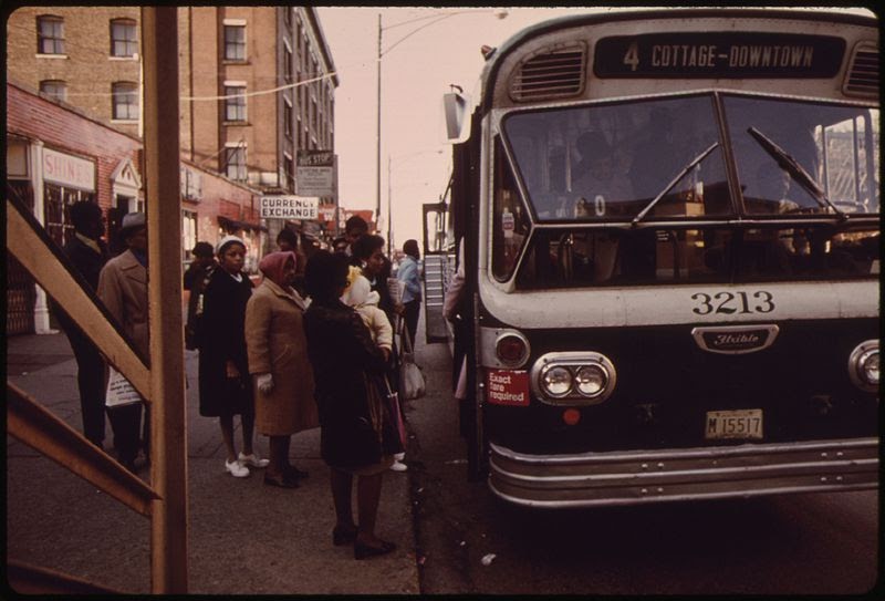 Black people boarding bus in Chicago during the 1970s