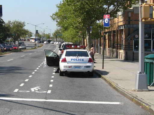 police car parked with door open 