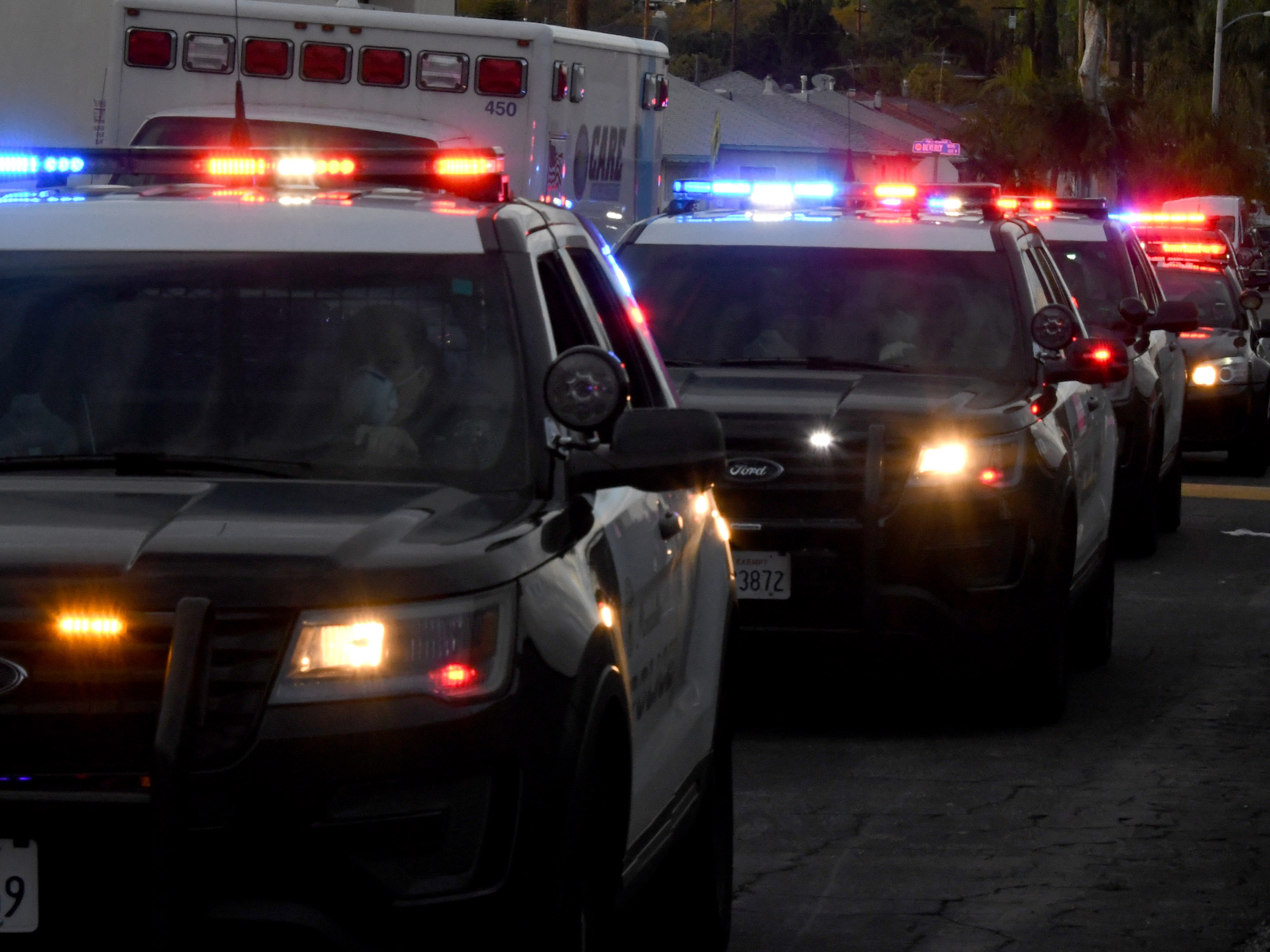 motorcade of police cars
