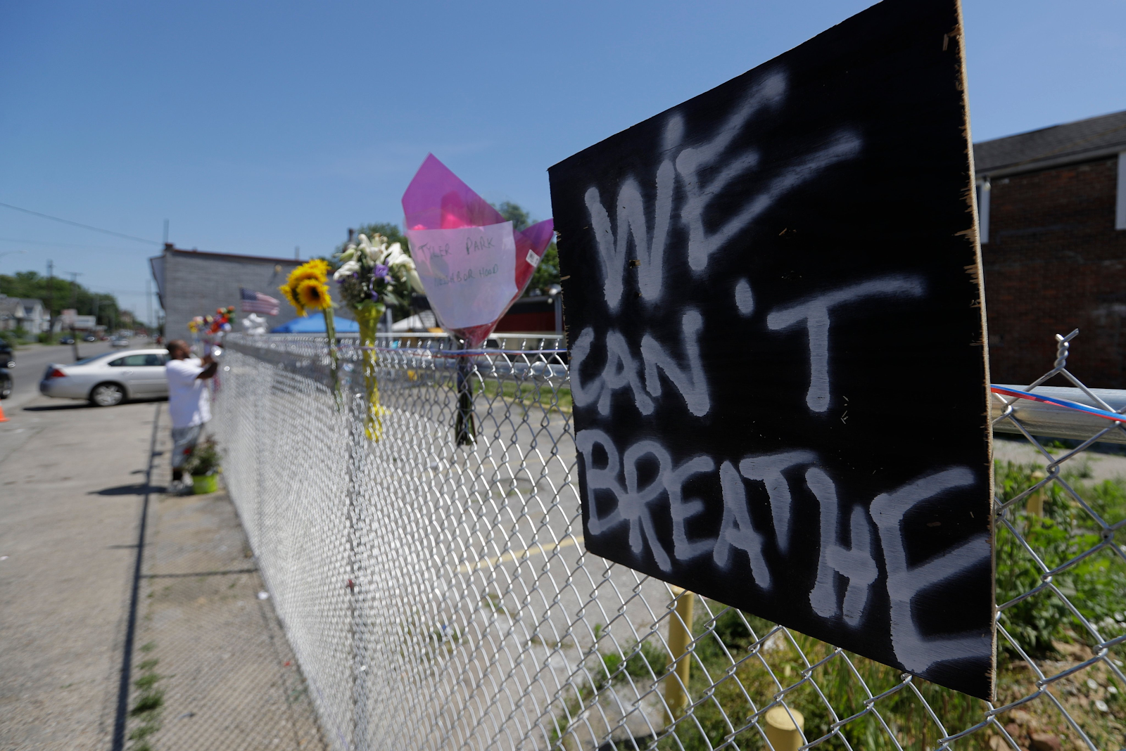 We Can't Breathe sign on fence