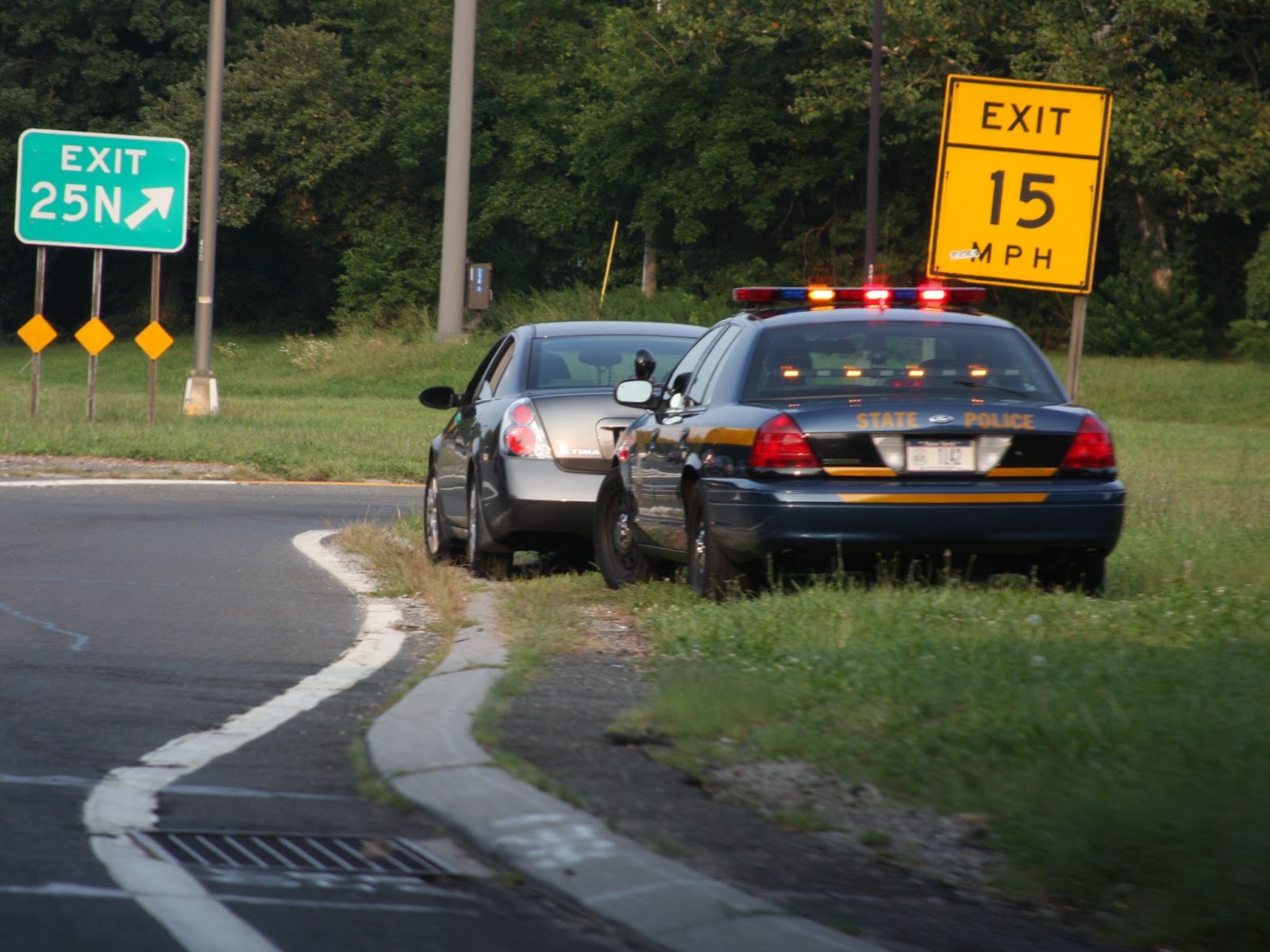 NY State Police squad car behind parked car