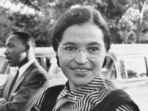 Profile of Rosa Parks standing next to Martin Luther King, Jr.