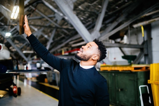 Man extending his hand to TV Screen