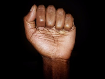 clench raised fist 