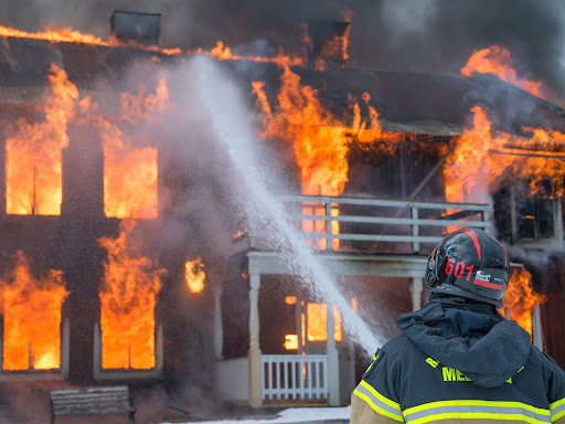 fireman fighting a building fire