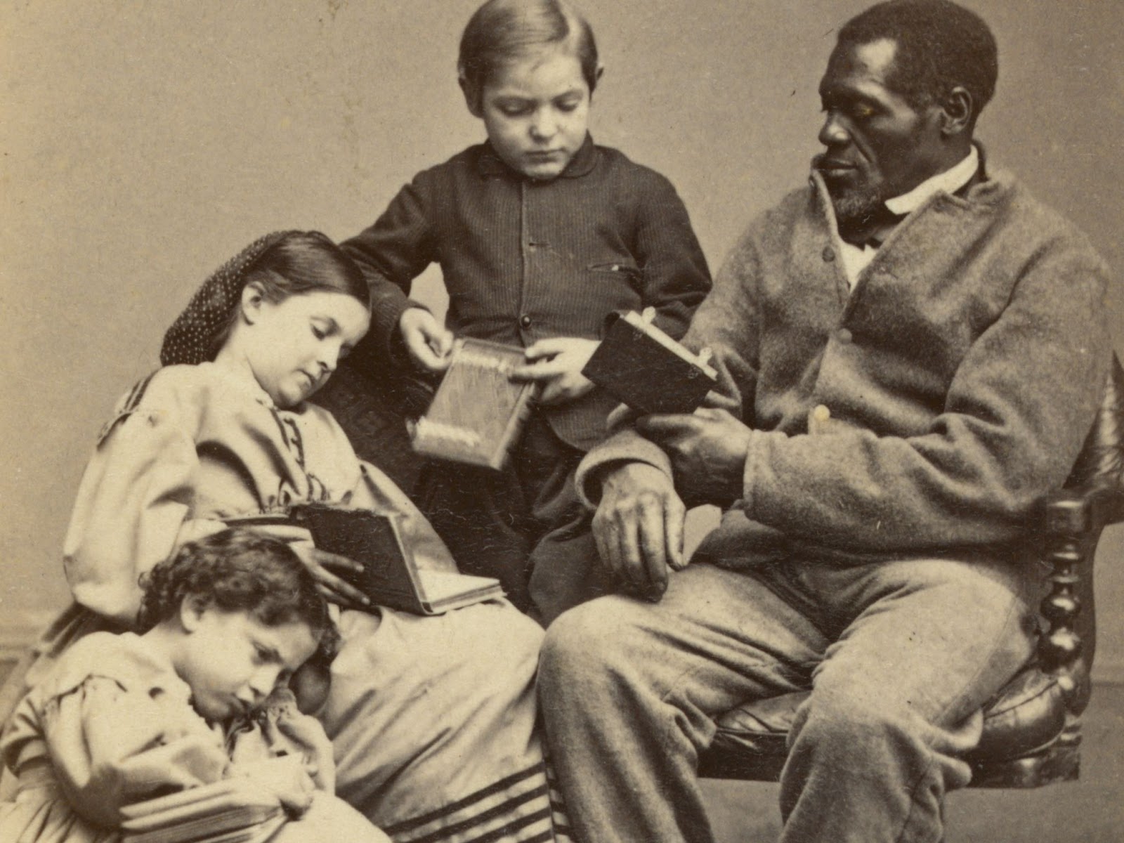 Man reading books to children
