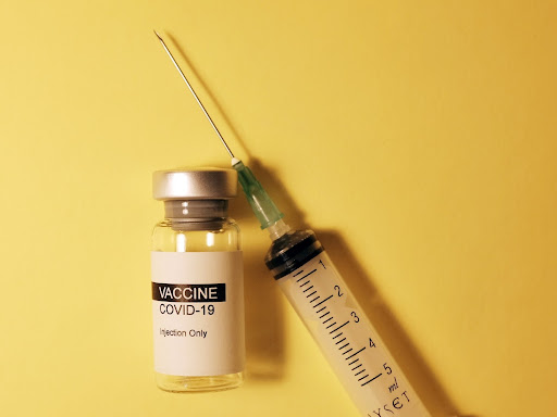 Covid-19 vaccine and syringe