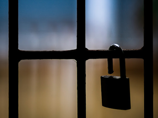 padlock on a wire gate