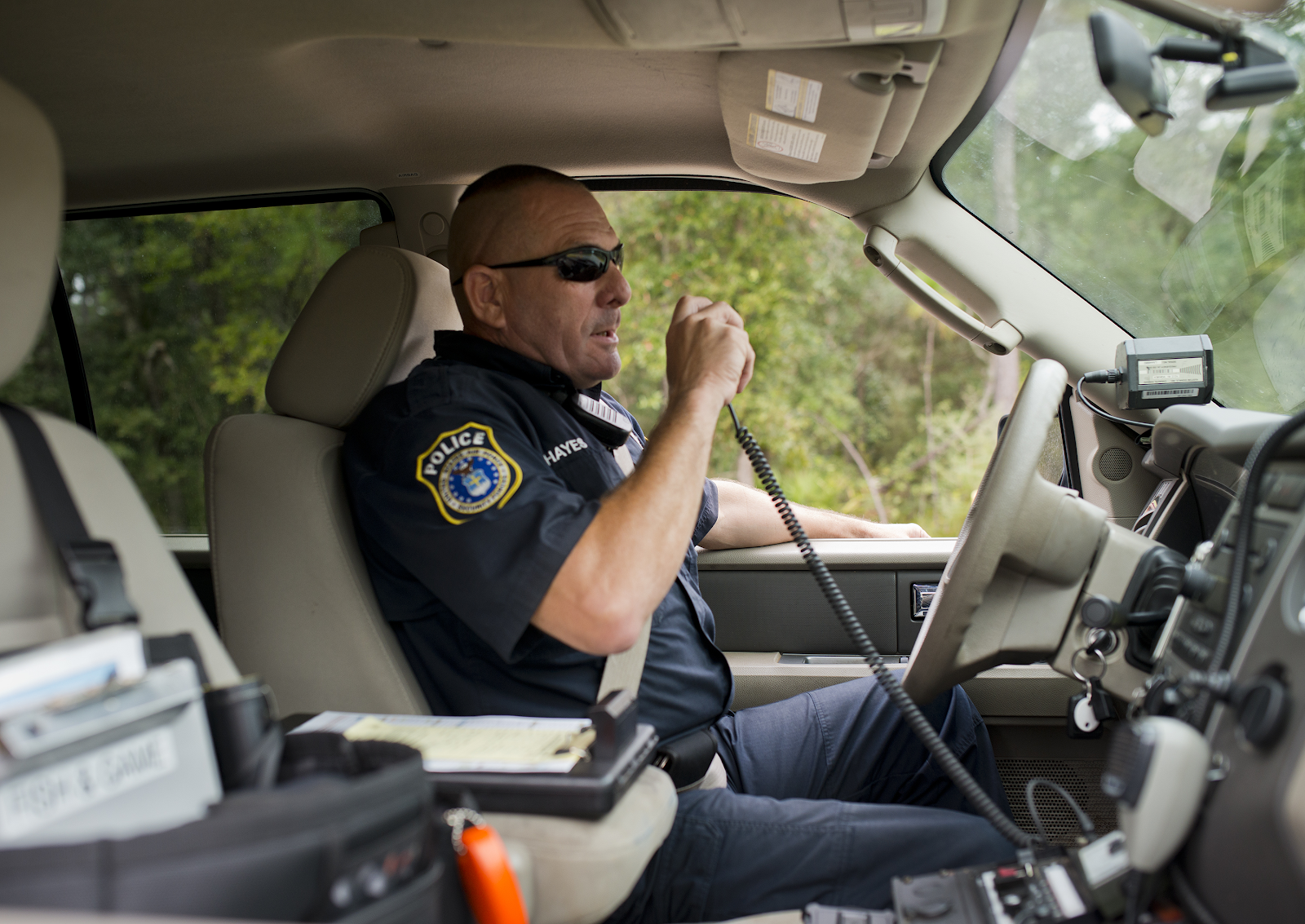 Cop on radio in car