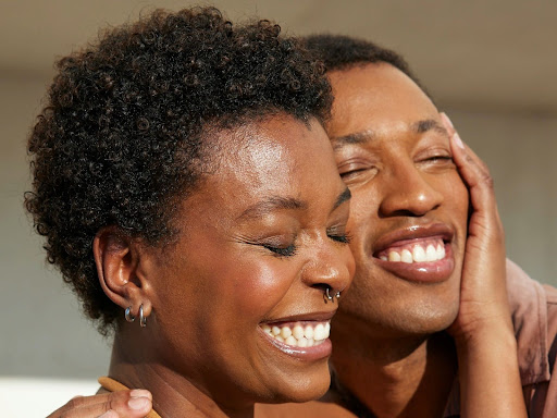 a man and a woman embracing each other